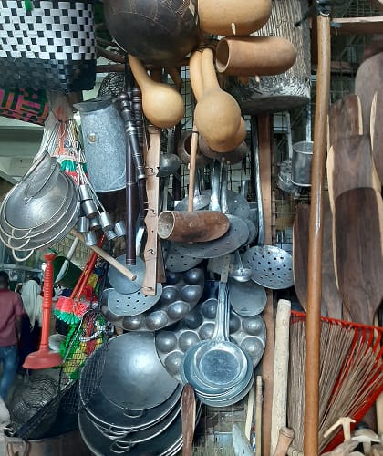 cooking utensils displayed in a tanzanian market