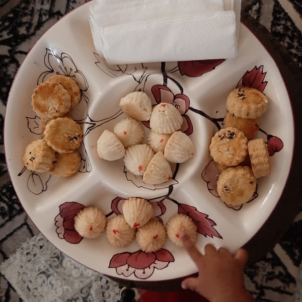 circular plate displaying home made cookies for eid in zanzibar