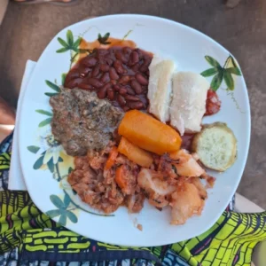 white plate with various traditional rwandan food