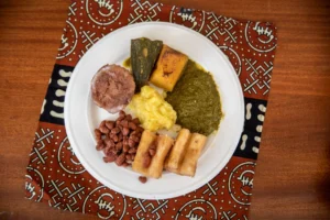 white plate displaying six traditional rwandan foods