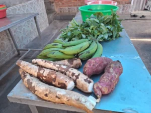 a metal table with ingredients for a rwandan cooking class