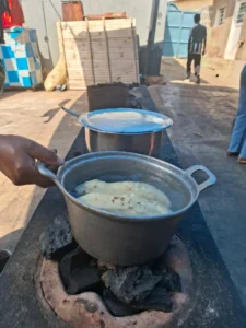 metal cooking pots sitting on a local charcoal stove in rwanda