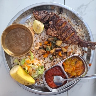metal plate with swahili rice and fish